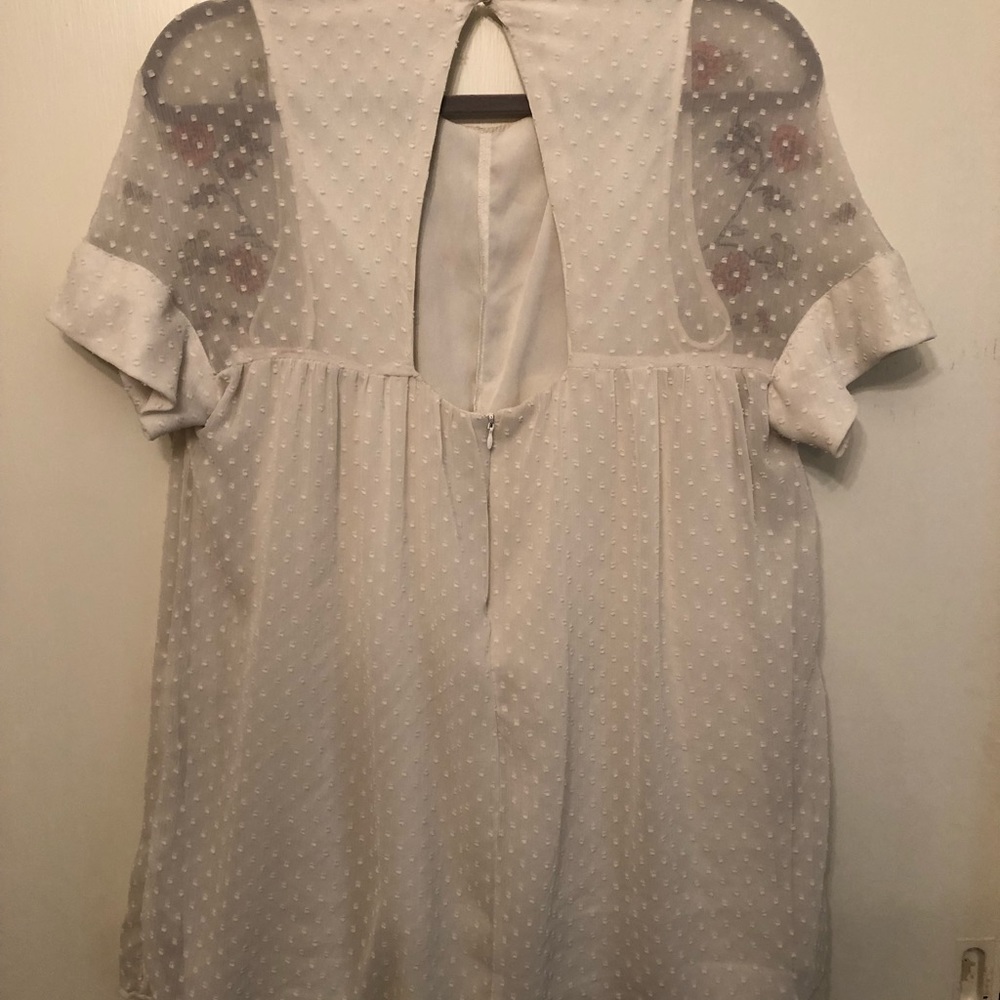White romper dress with flower detail